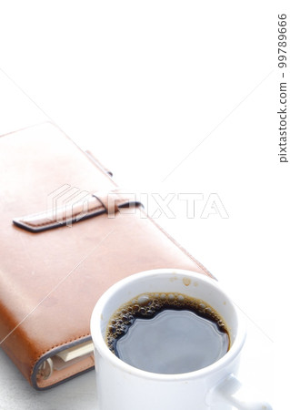 Brown leather notebook and black coffee Brown leather notebook and black coffee 99789666