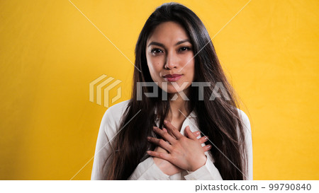 Young pretty woman is grateful and happy 99790840