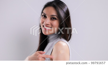 Young woman is happy she was vaccinated 99791657