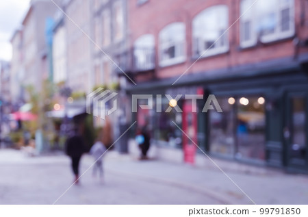 Blurred abstract street view of downtown buildings and shopping stores with bokeh lights background Blurred abstract street view of downtown buildings and shopping stores with bokeh lights background 99791850