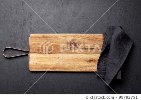 Wooden cutting board and kitchen towel 99792751