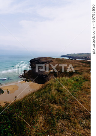 Antuerta Beach. Beach surrounded by cliffs and very popular for surfers 99793650