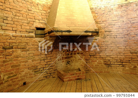 An old fireplace in the premises of the castle tower. Interior of Turaida castle near Sigulda. Latvia An old fireplace in the premises of the castle tower. Interior of Turaida castle near Sigulda. Latvia 99793844
