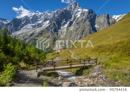 Landscape of Aosta valley near Mont Blanc massif with river and bridge, Italy Landscape of Aosta valley near Mont Blanc massif with river and bridge, Italy 99794416