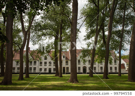 Flemish and ornate architecture of idyllic Bruges with garden park, Flanders, Belgium Flemish and ornate architecture of idyllic Bruges with garden park, Flanders, Belgium 99794558