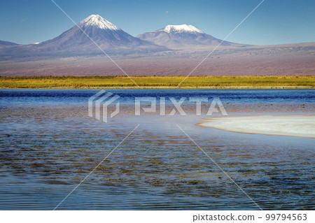 Licancabur with reflection lake and volcanic landscape at Sunset, Atacama, Chile 99794563