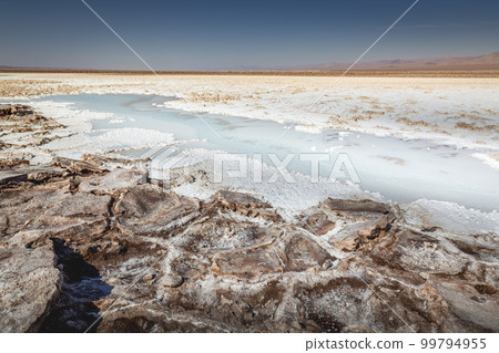 Salt lake, volcanic landscape at sunrise, Atacama, Chile border with Bolivia 99794955