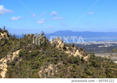 Otsu city and Mt. Hiei seen through the giant rocks of Mt. 99795122