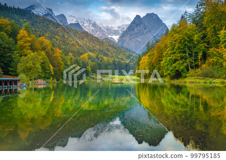 Riessersee alpine lake reflection at sunrise, Garmisch, Bavarian alps, Germany 99795185