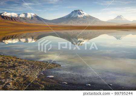 Salt lake Lejia reflection, idyllic volcanic landscape at Sunset, Atacama, Chile Salt lake Lejia reflection, idyllic volcanic landscape at Sunset, Atacama, Chile 99795244