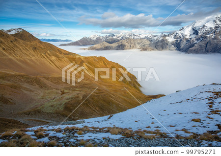 Stelvio pass, mountain dramatic landscape at dawn above mist, Italy 99795271
