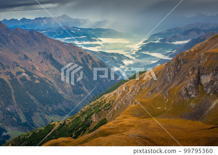 Hohe Tauern mountains and lake from above Grossglockner road at dawn, Austria Hohe Tauern mountains and lake from above Grossglockner road at dawn, Austria 99795360