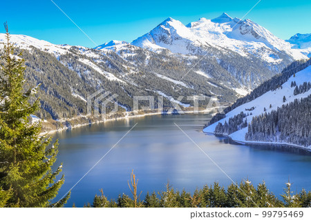 Alpine lake reservoir near Zillertal alps valley, Tyrol alps, Austria 99795469