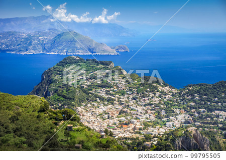 Above Capri city cliffs and Faraglioni with boats and yacht, amalfi coast, Italy 99795505
