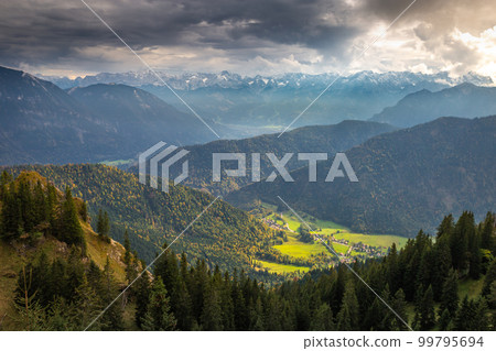 Bavarian alps and valleys from above at dramatic autumn sky, Garmisch, Germany 99795694