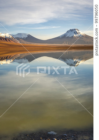 Salt lake Lejia reflection, idyllic volcanic landscape at Sunset, Atacama, Chile Salt lake Lejia reflection, idyllic volcanic landscape at Sunset, Atacama, Chile 99796050
