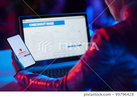 Closeup on modern woman browsing fraud e-commerce website Closeup on modern woman browsing fraud e-commerce website 99796428