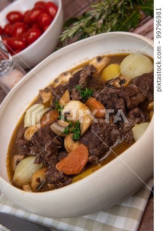 Beef bourguignon recipe, beef stew with wine sauce and vegetables Beef bourguignon recipe, beef stew with wine sauce and vegetables 99796981