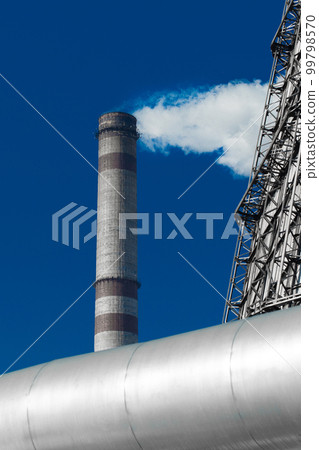 Pollution of the environment, atmosphere, air, environmental problems. Smoke is emitted from the industrial steam pipe of the plant tower Pollution of the environment, atmosphere, air, environmental problems. Smoke is emitted from the industrial steam pipe of the plant tower 99798570
