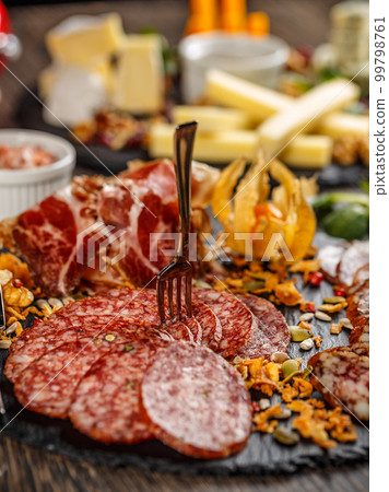 Cutting sausage and cured meat Cutting sausage and cured meat 99798761