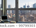 A view, a laptop and a book from an apartment in NY 99799303