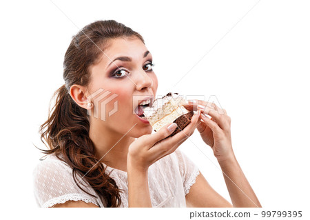 Woman eating cake 99799395