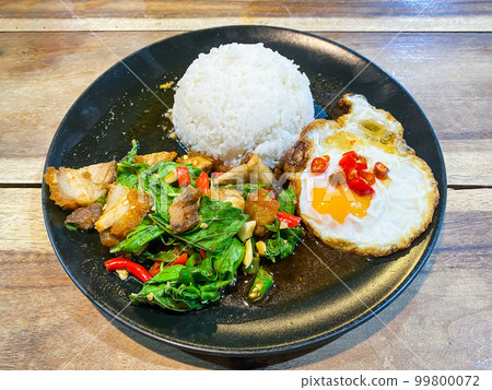 Rice topped with crispy pork belly with Thai basil and fried egg 99800072