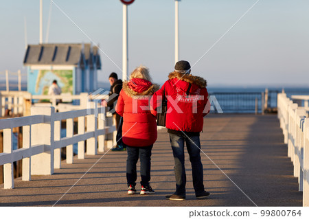 couple walking on the pieron a sunny day couple walking on the pieron a sunny day 99800764