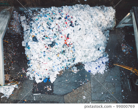 Shredded plastic waste at the recycling center, directly above  99800769