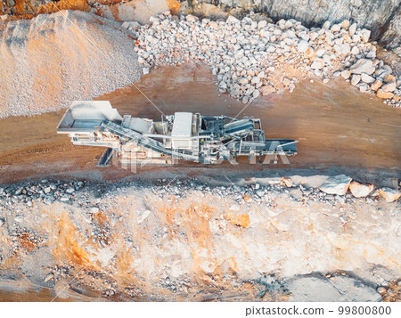 Top down view at gravel being transported on conveyor belt in the quarry 99800800