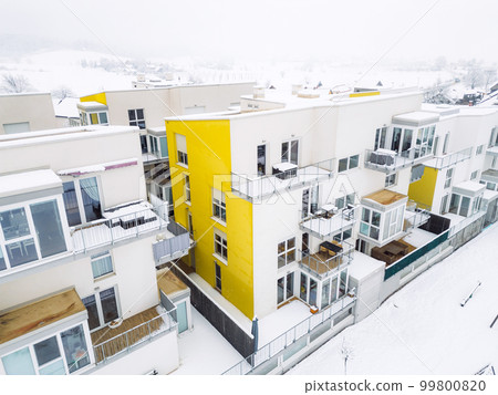 Newly build modern apartments covered in snow on a winter day 99800820
