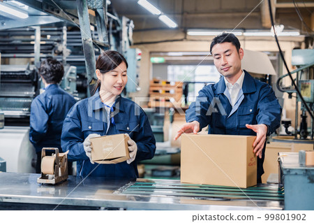 Workers doing shipping work at the distribution center 99801902