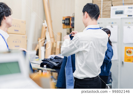Employees taking a break in the backyard after work Employees taking a break in the backyard after work 99802146