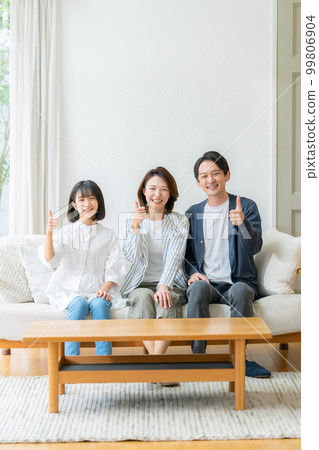 Parent and child family living room sofa thumbs up 99806904