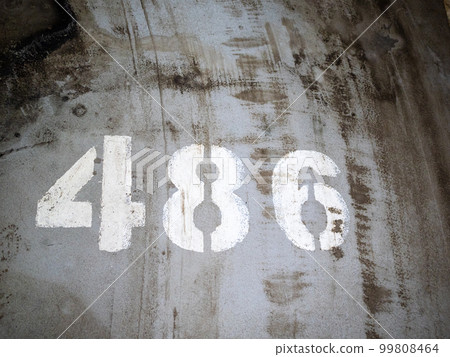 number of parking place on dirty concrete surface 99808464