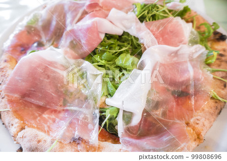 Pizza of raw ham 99808696