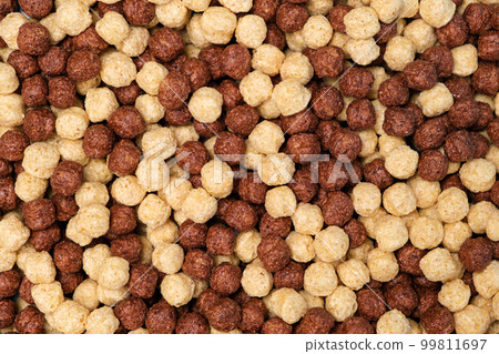 Breakfast cereal - corn and wheat balls with cocoa on a blue background, top view 99811697