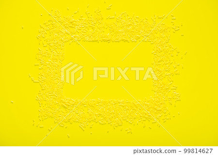 greeting wreath of colorful sprinkles on yellow 99814627