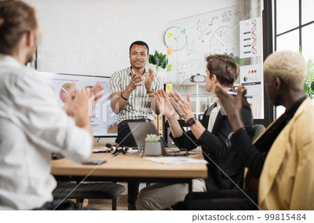 Focus on clapping hands of multi ethnic male partners in formal clothes Focus on clapping hands of multi ethnic male partners in formal clothes 99815484