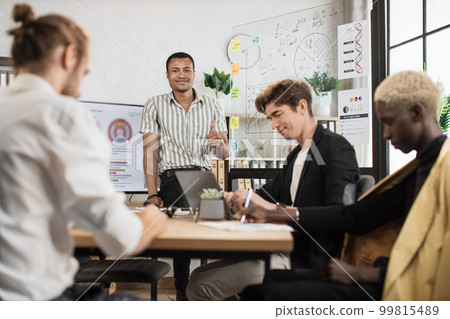 African man standing near big monitor and glass flip chart African man standing near big monitor and glass flip chart 99815489