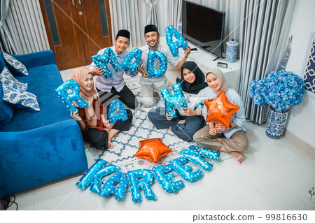 group of young Muslims preparing accessories and decorations for Ramadan group of young Muslims preparing accessories and decorations for Ramadan 99816630