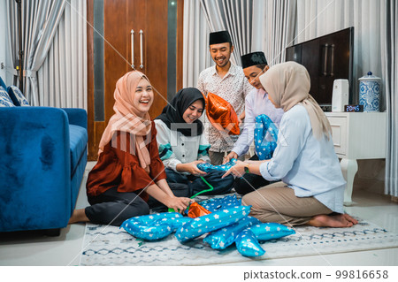 group of young Muslims gather to prepare for Ramadan celebrations 99816658