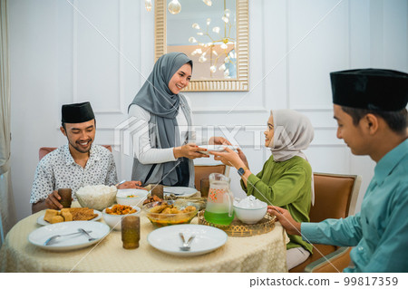 happy family when breaking fast dinner together in the dining room 99817359