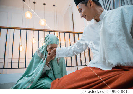 women kiss a man's hand as a sign of respect women kiss a man's hand as a sign of respect 99818013