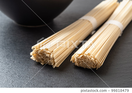 Raw udon nudles are ready for cooking. Raw udon nudles are ready for cooking. 99818479