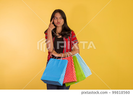 thingking asian woman touch her head with her forefinger thingking asian woman touch her head with her forefinger 99818560