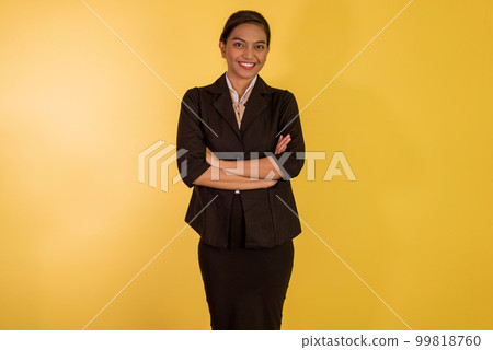 asian woman in formal outfit standing with handcrossed and smiling 99818760