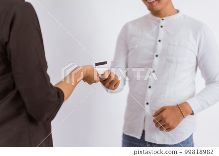 the hand of asian woman giving the blank card to the man 99818982