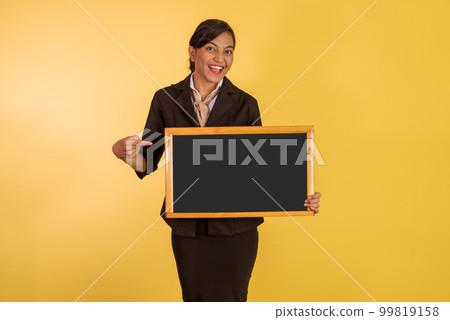 asian woman in formal outfit pointing on the blackboard at her hand 99819158
