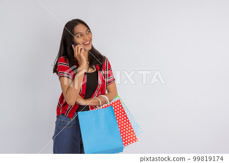 a beautiful asian woman calling someone on phone 99819174